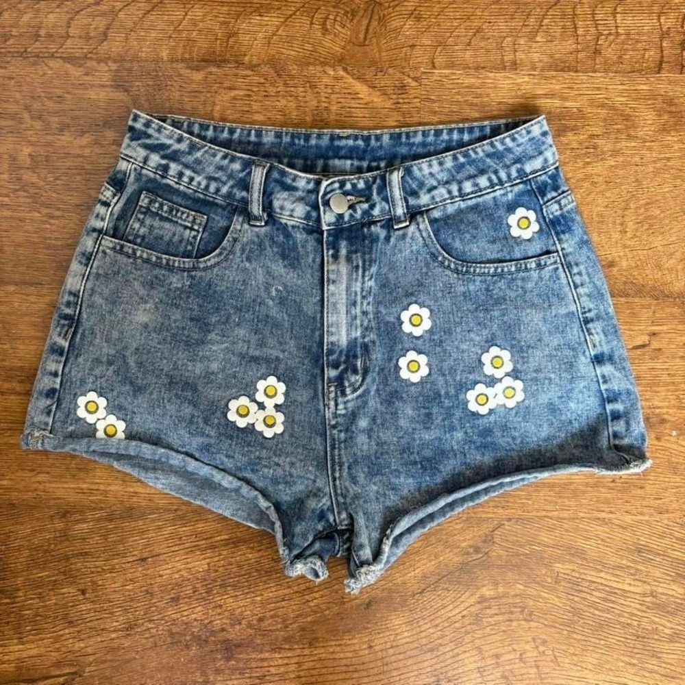 SHEIN blue denim shorts with daisy graphics